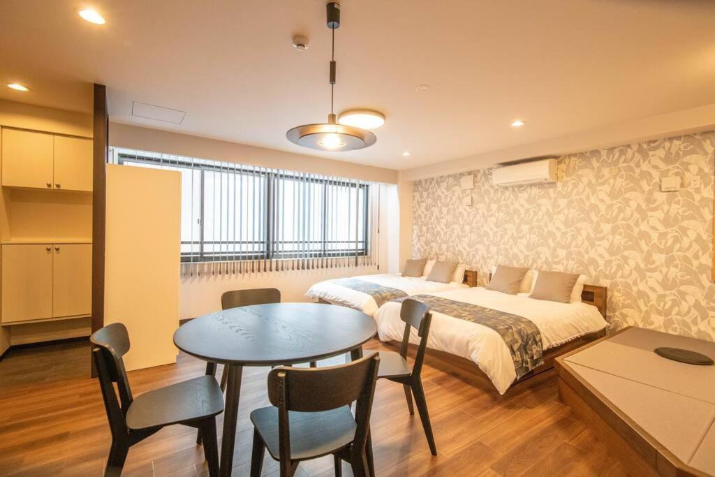 Apartamento 浅草禅心居201室 浅草駅徒歩15分 2024年4月ニューオープン 43平米丸貸し切り ダブルベット2台と畳敷き布団2組 家庭式用品設備完備 *